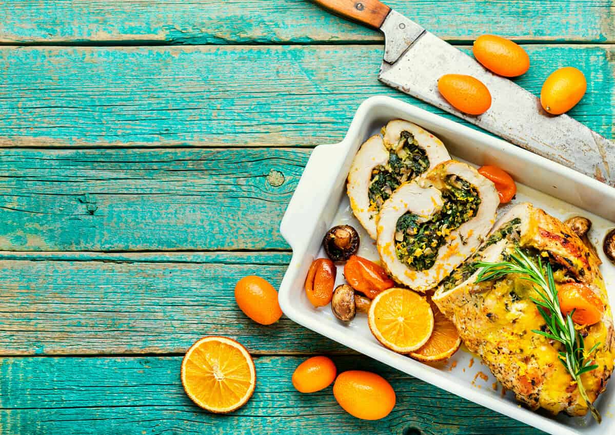 Turkey meatloaf with spinach and mushrooms.Meat roll with kumquat and orange sauce.Copy space