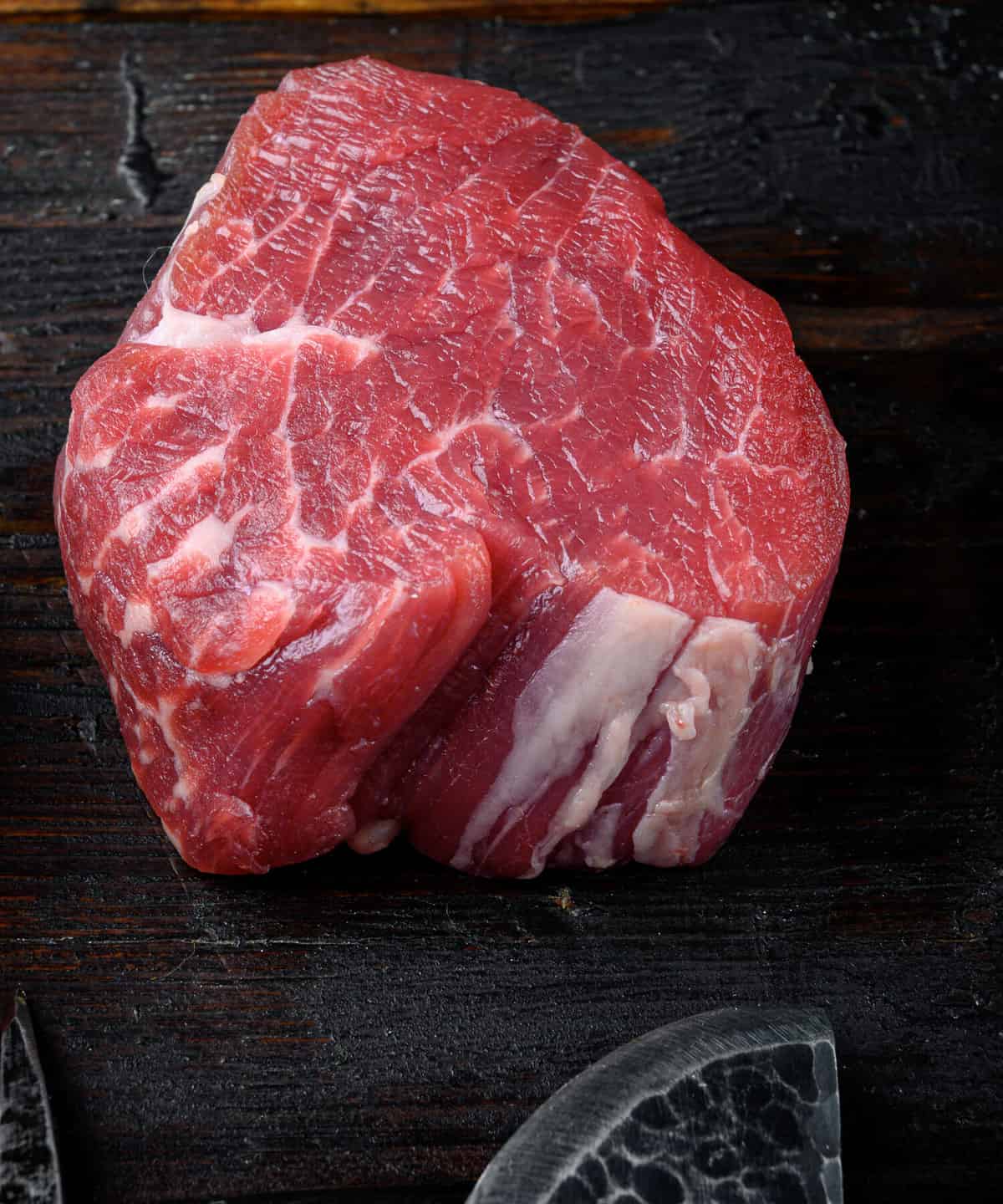 Raw beef fillet steaks with spices set, on old dark wooden table background