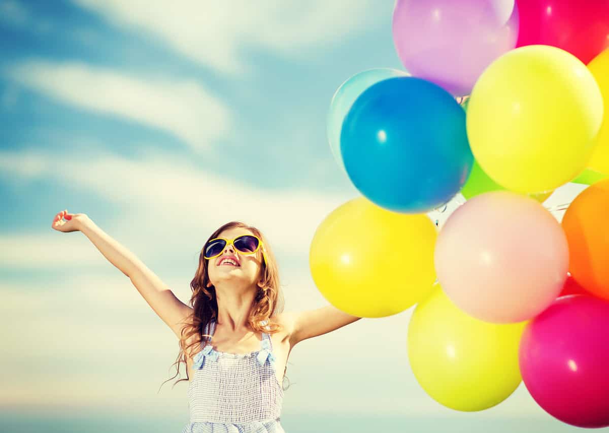 summer holidays, celebration, family, children and people concept - happy girl with colorful balloons