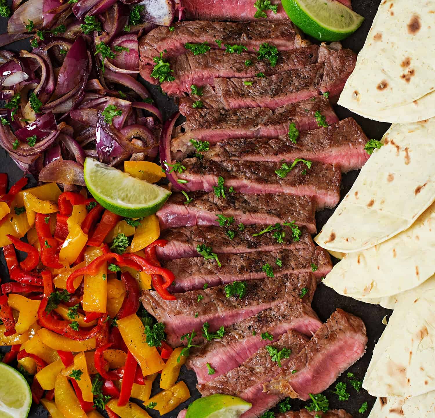 Mexican fajitas for beef steak and grilled vegetables. Top view