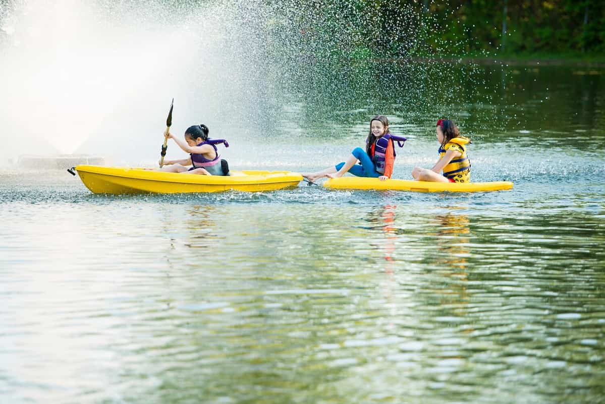 Girls canoeing on lake