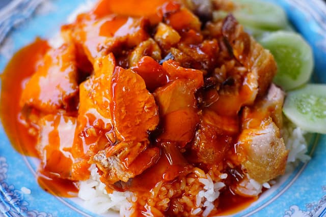 Barbecued red pork in sauce with rice