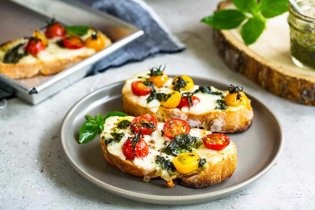 Melt Mozzarella with Cherry Tomatoes and Pesto on toast