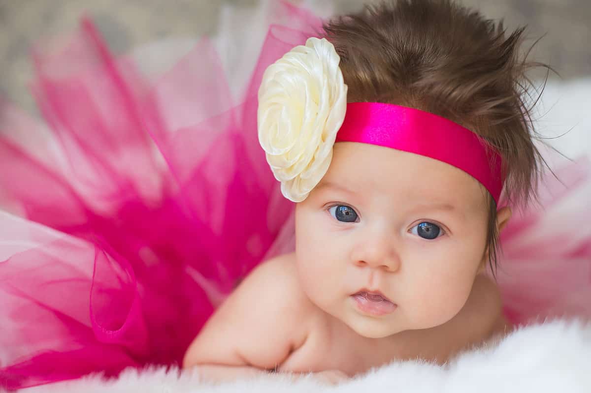 baby girl in hot pink tutu and headband