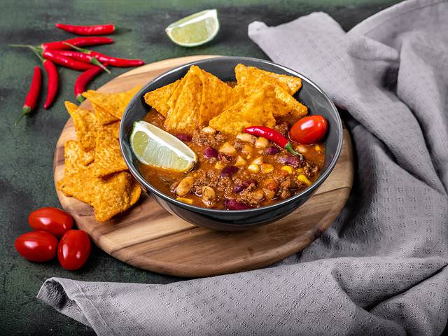 Mexican soup Taco Soup with tacos and chilies, beans, lime, and tomatoes