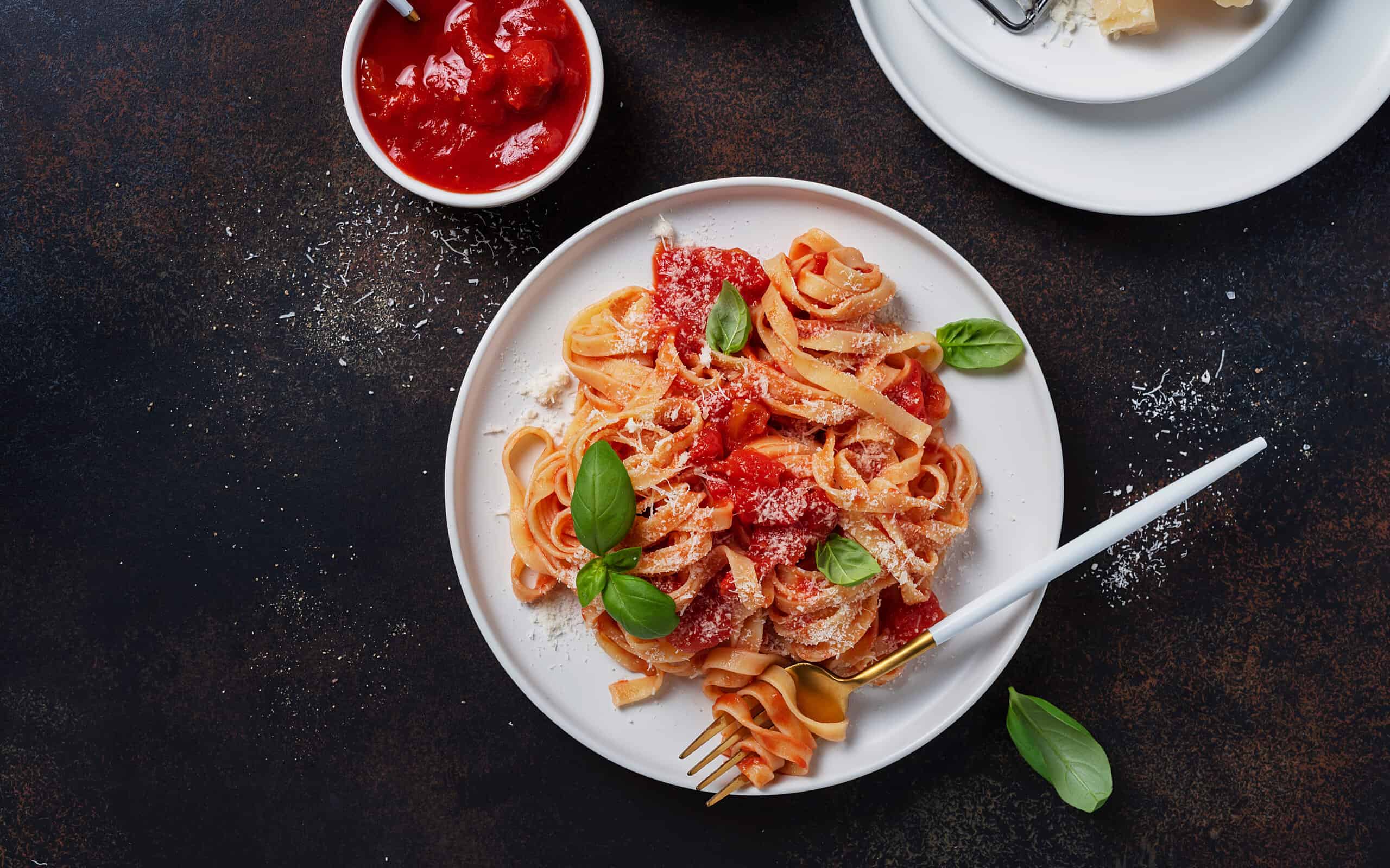 Traditional italian pasta with tomato, basil and parmesan