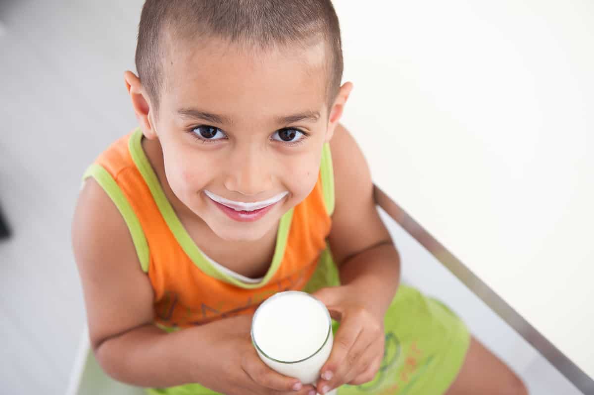 little boy drinking milk