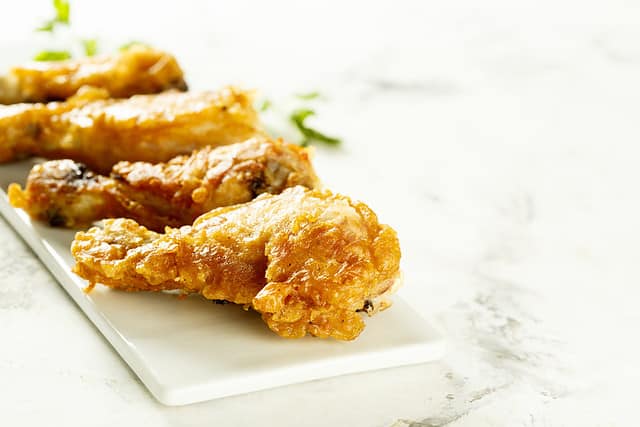 Battered chicken on white plate