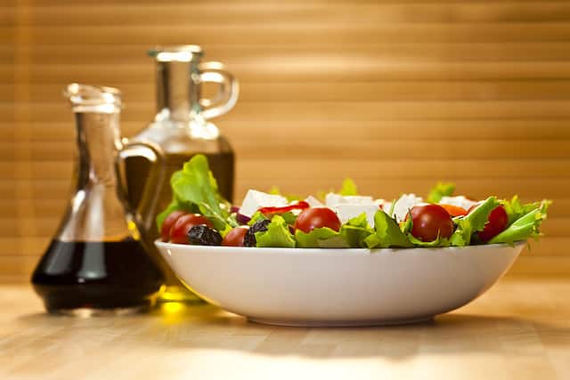 Tomato, mozzarella, or feta cheese salad with black olives, olive oil and balsamic vinegar dressing