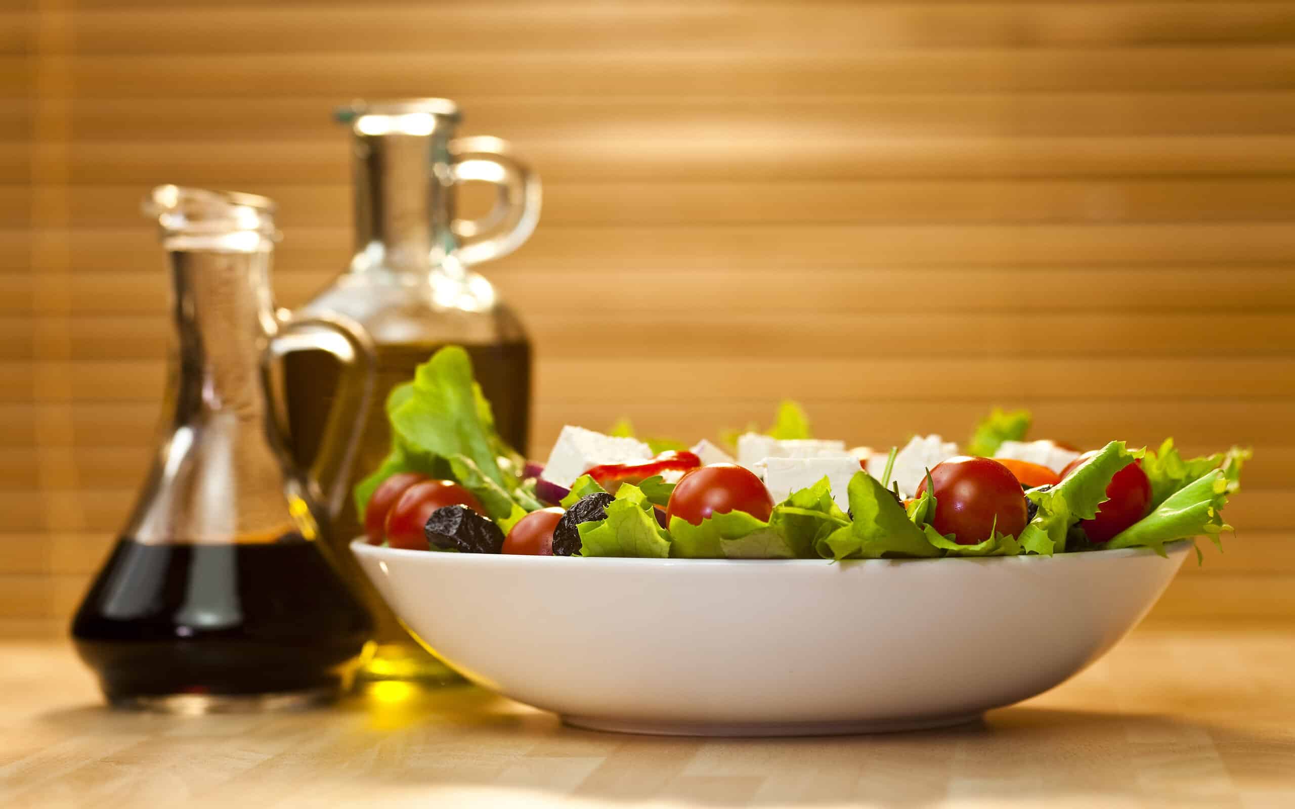 Tomato, mozzarella, or feta cheese salad with black olives, olive oil and balsamic vinegar dressing