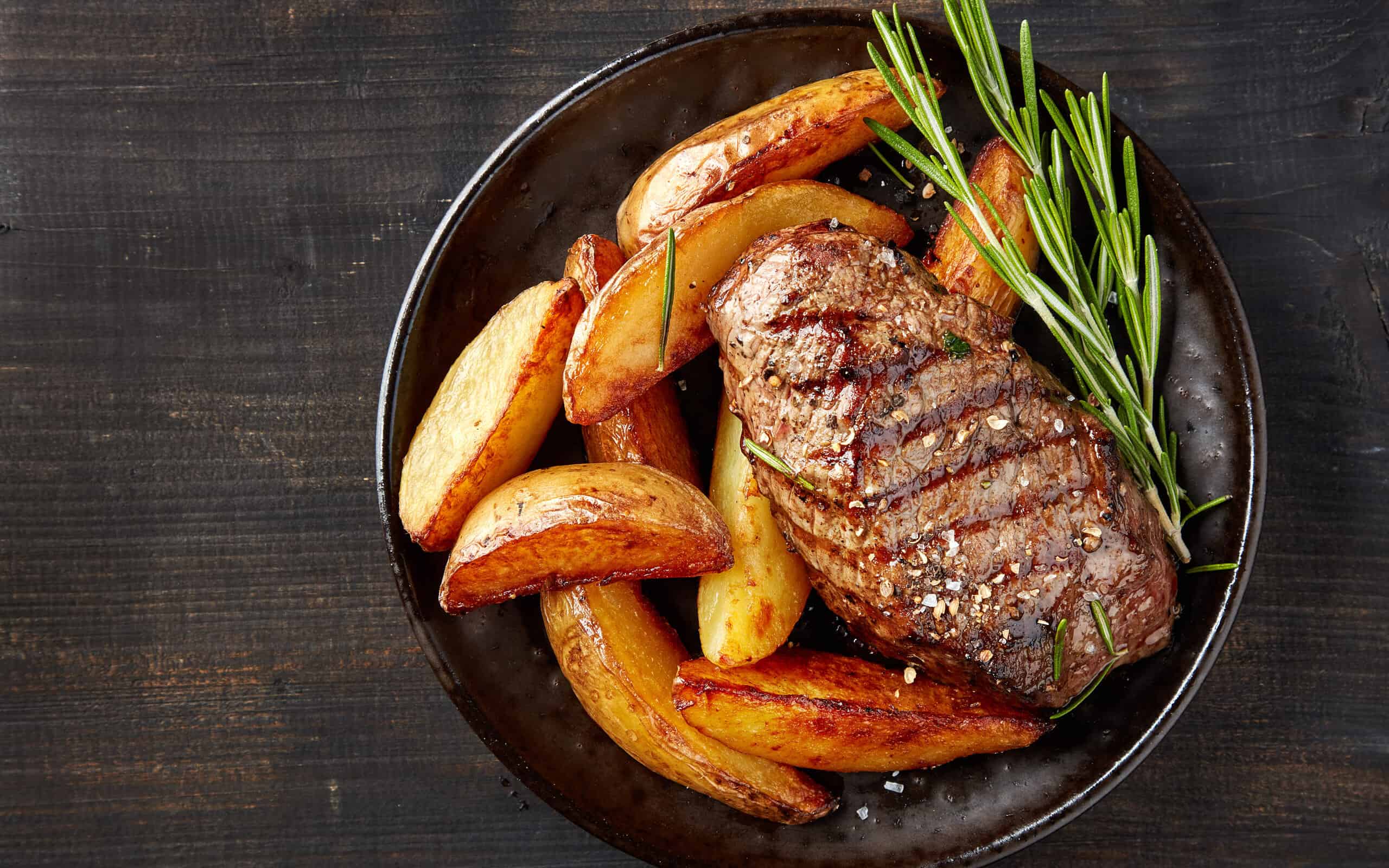 grilled beef steak and potatoes