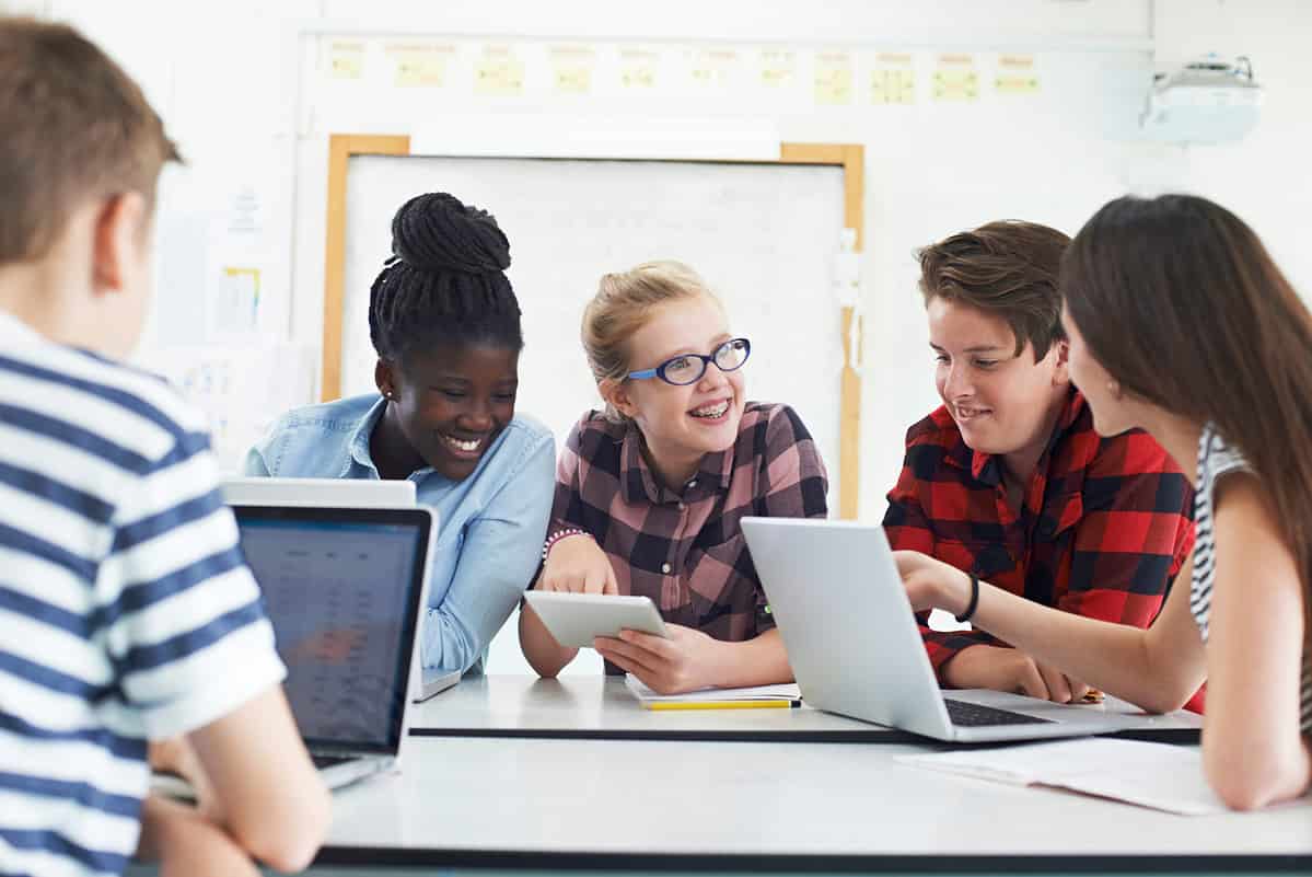 Group of Teenage Students Collaborating on Project in It Class