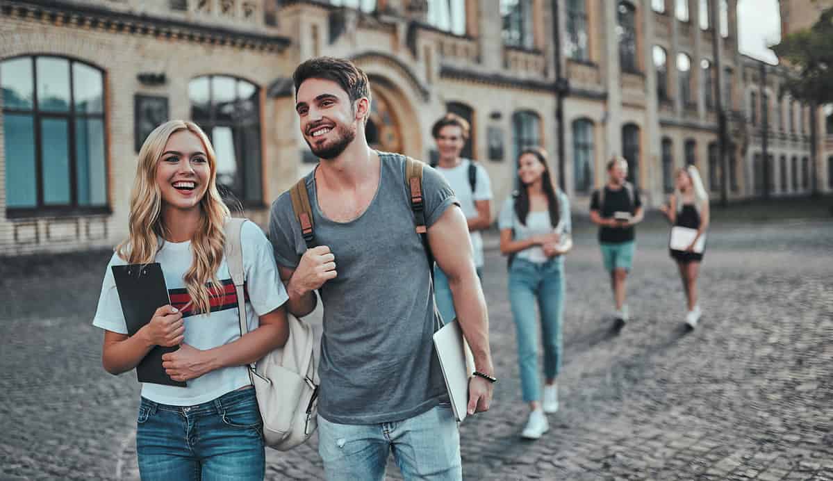 Photo of university students walking from a lecture.