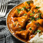 Homemade Indian Butter Chicken with Rice and Naan Bread