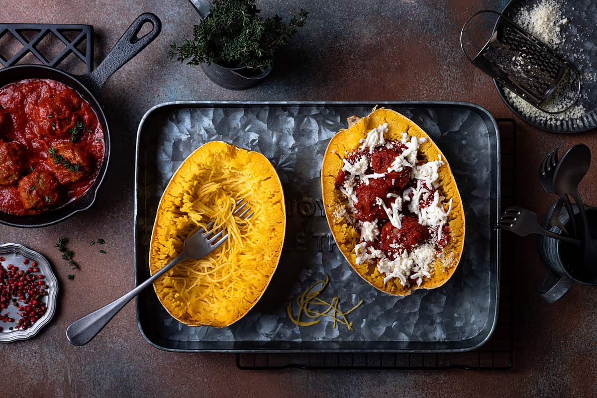 Cooking stuffed Spaghetti squash with meatballs in tomato sauce