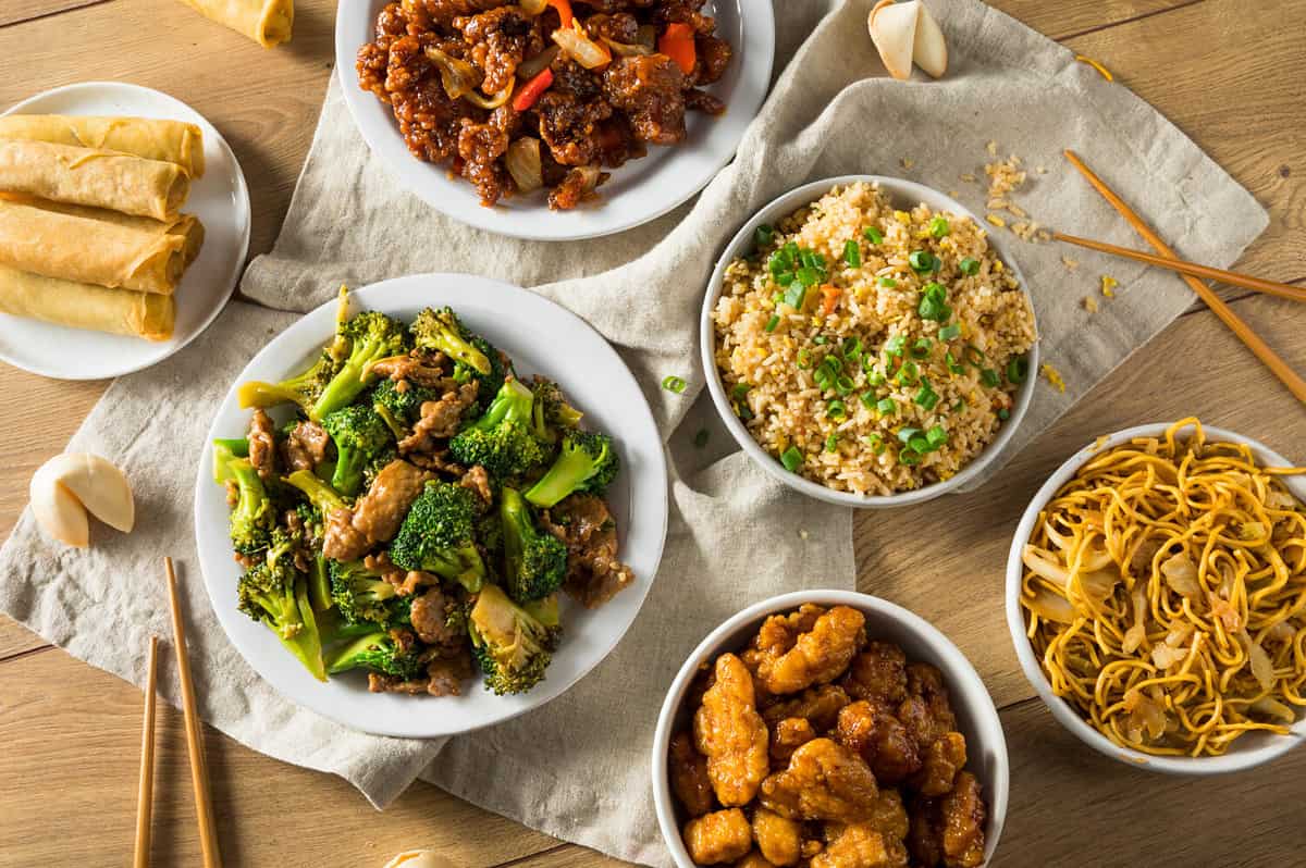 Spicy Chinese Take Out Food with Chopsticks and Fortune Cookies