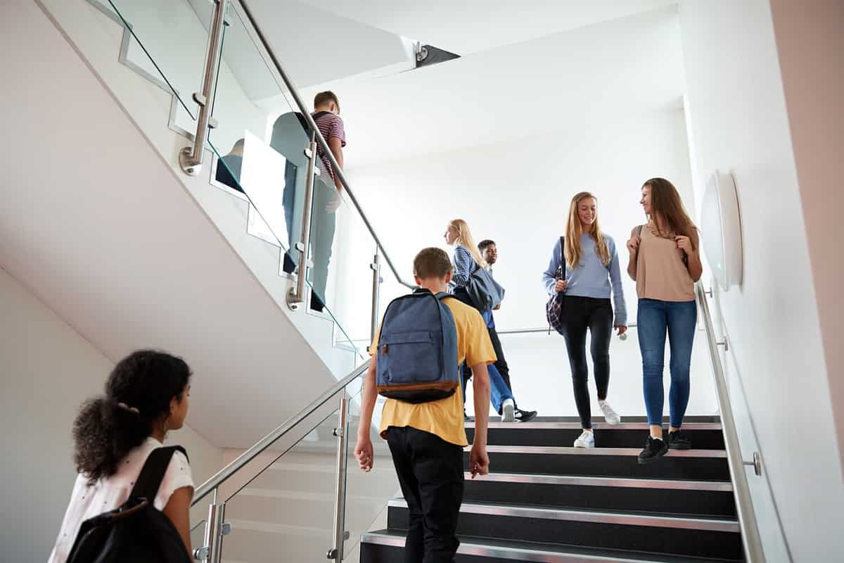 High school students walking down the stairs.