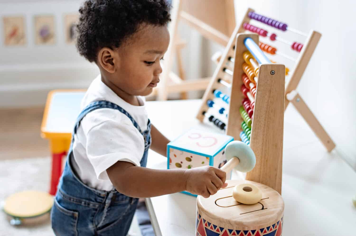 Young boy playing with educational toys