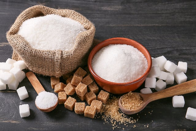 Different sugar on dark table