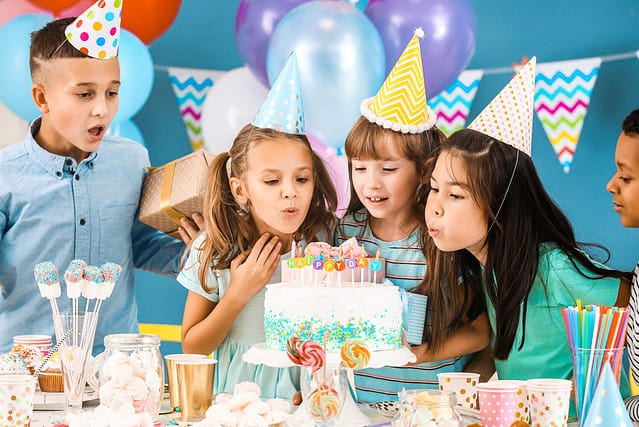 Little children celebrating Birthday at home