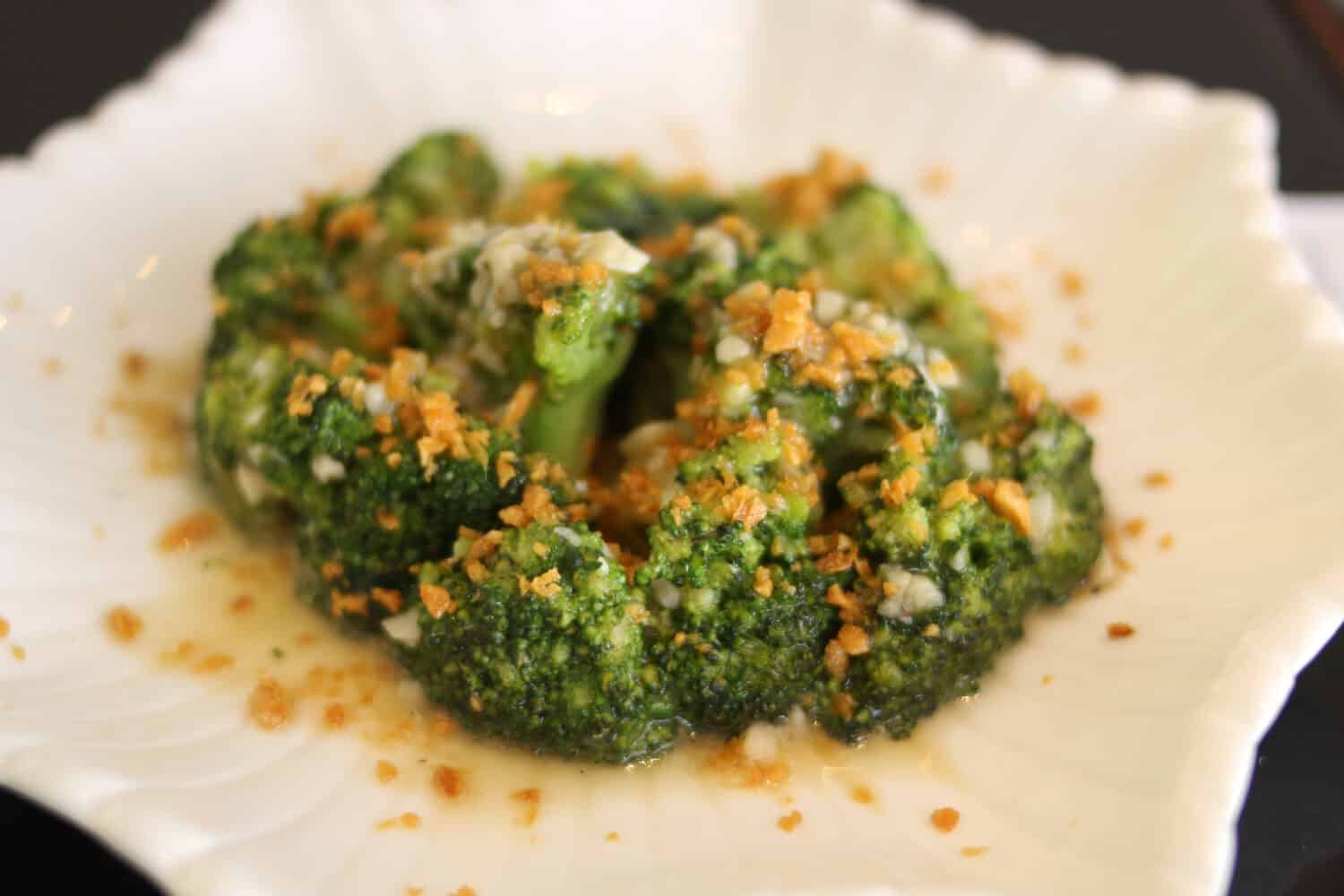 Broccoli vegetables served with carrots and garlic. Garlic Butter Broccoli and Carrots. Close up