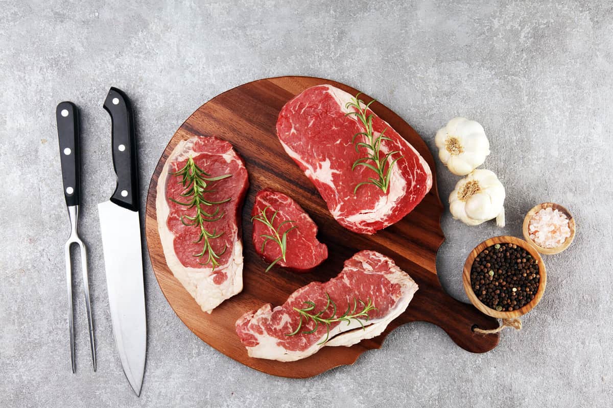 Steak raw. Barbecue Rib Eye Steak, dry Aged Wagyu Entrecote. Variety of Raw Black Angus Prime meat steaks Machete, Striploin, Rib eye, Tenderloin fillet mignon