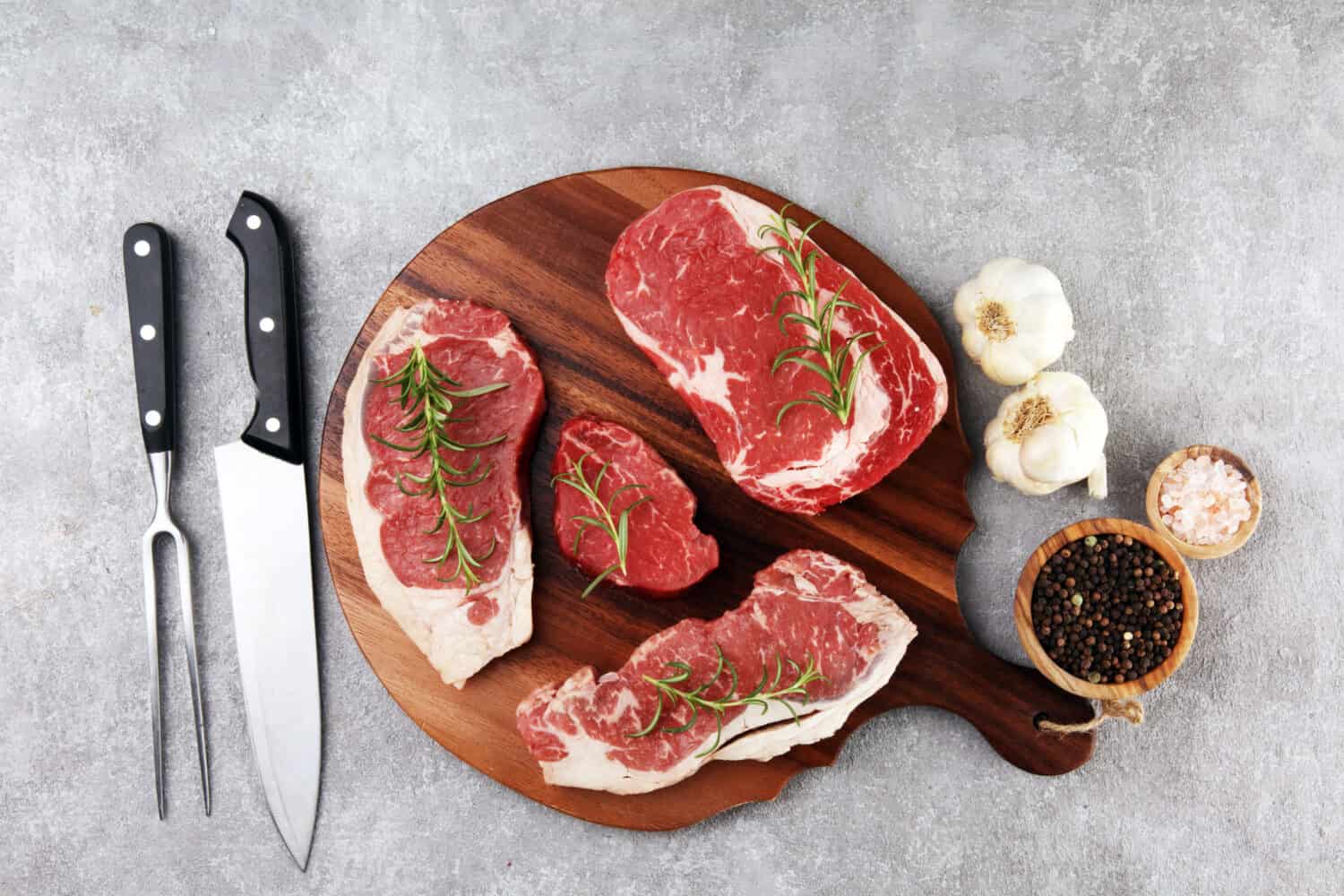 Image: beats1, Shutterstock. Steak raw. Barbecue Rib Eye Steak, dry Aged Wagyu Entrecote. Variety of Raw Black Angus Prime meat steaks Machete, Striploin, Rib eye, Tenderloin fillet mignon