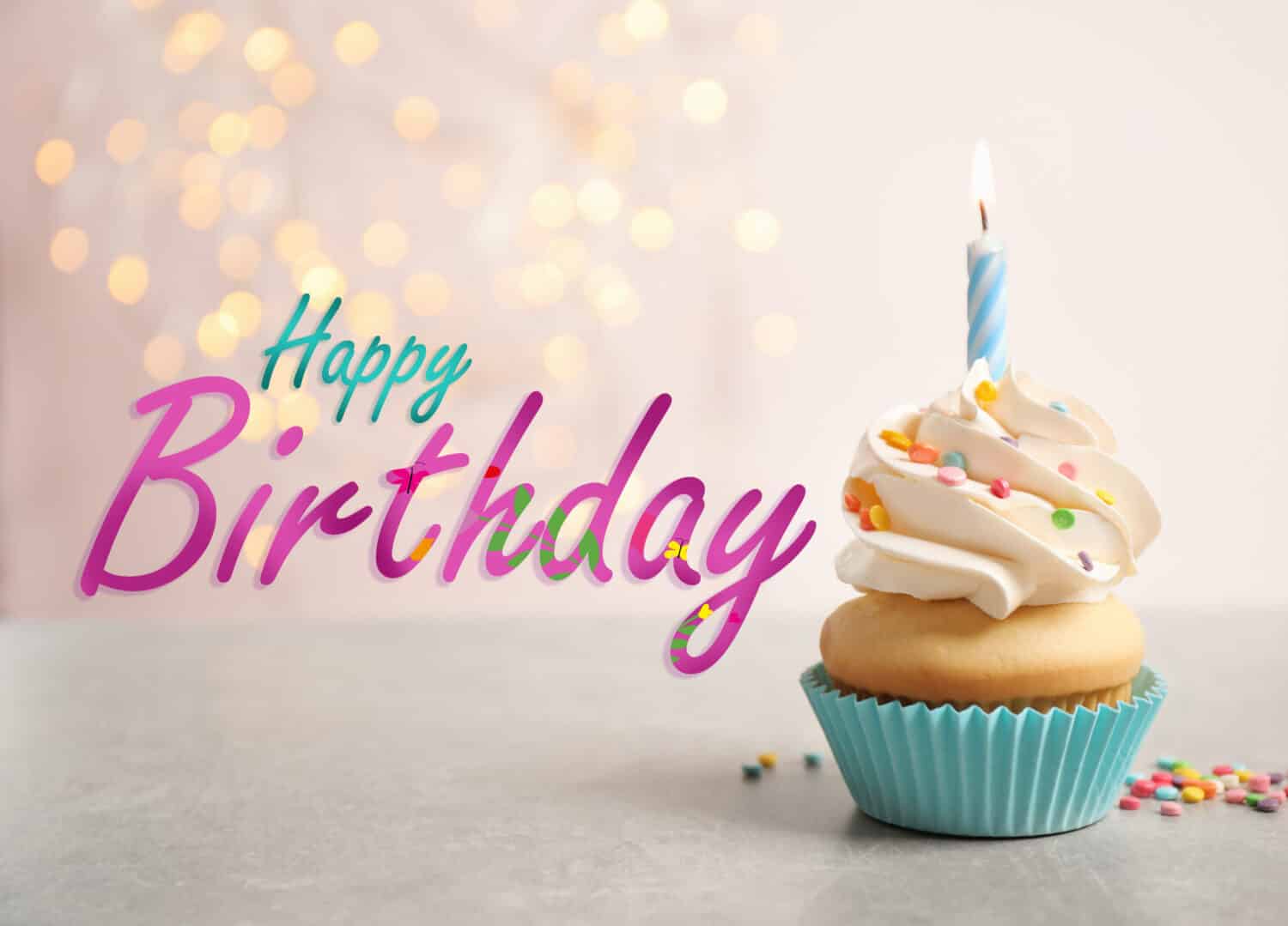 Text Happy Birthday and delicious cupcake with candle on blurred background