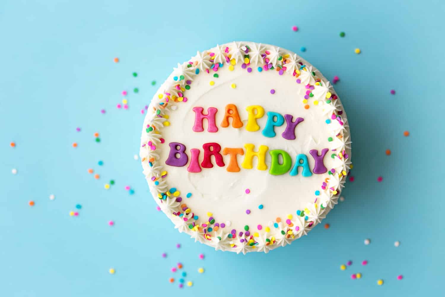 Happy birthday cake with rainbow lettering