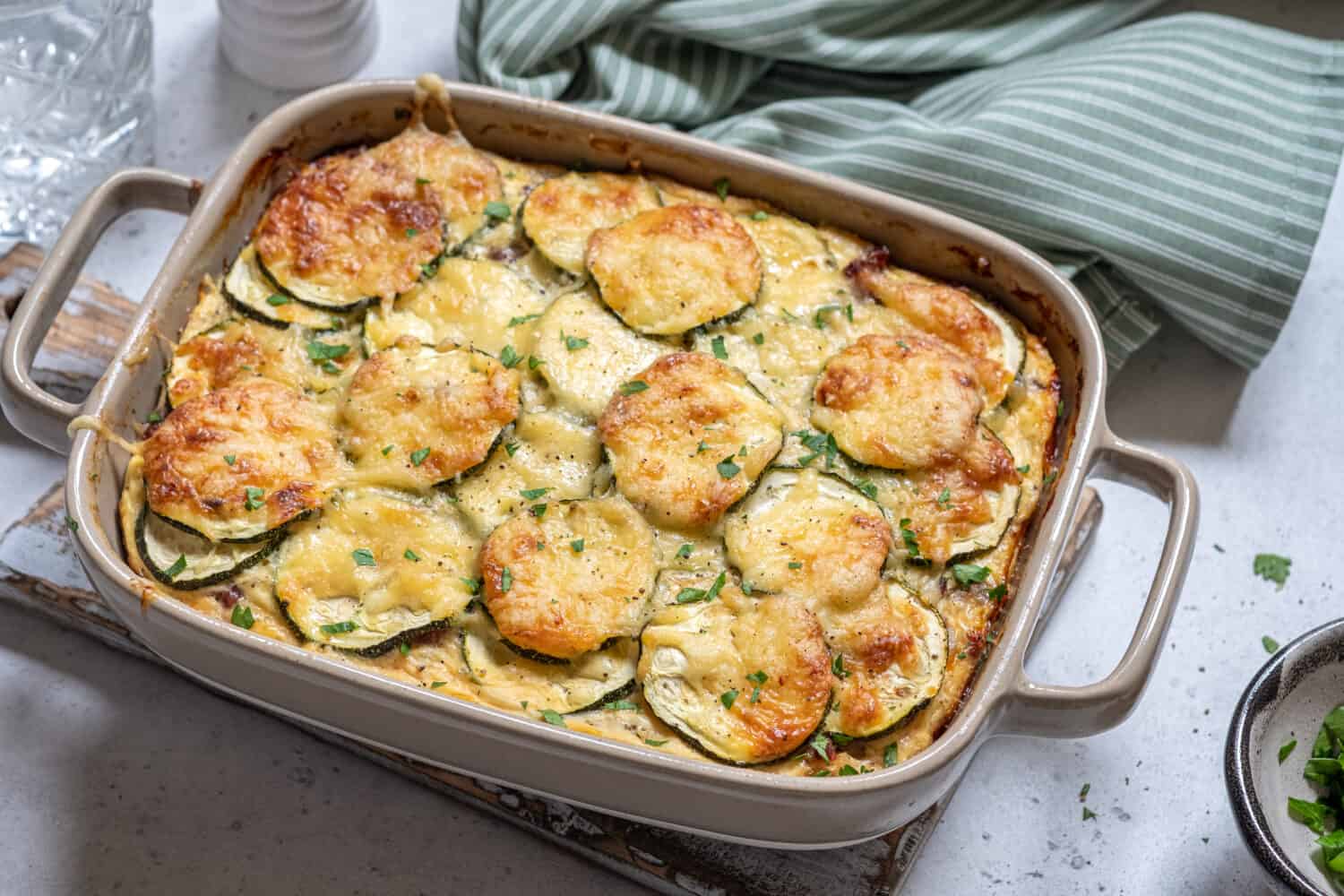 casserole with cheese and zucchini in baking dish