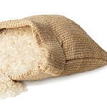 long rice in burlap sack with ears isolated on white background