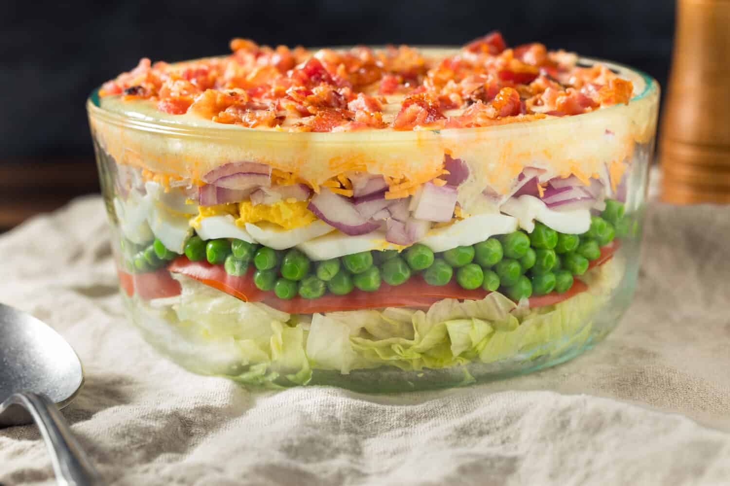 Homemade Seven Layer Salad with Eggs Bacon Peas and Lettuce