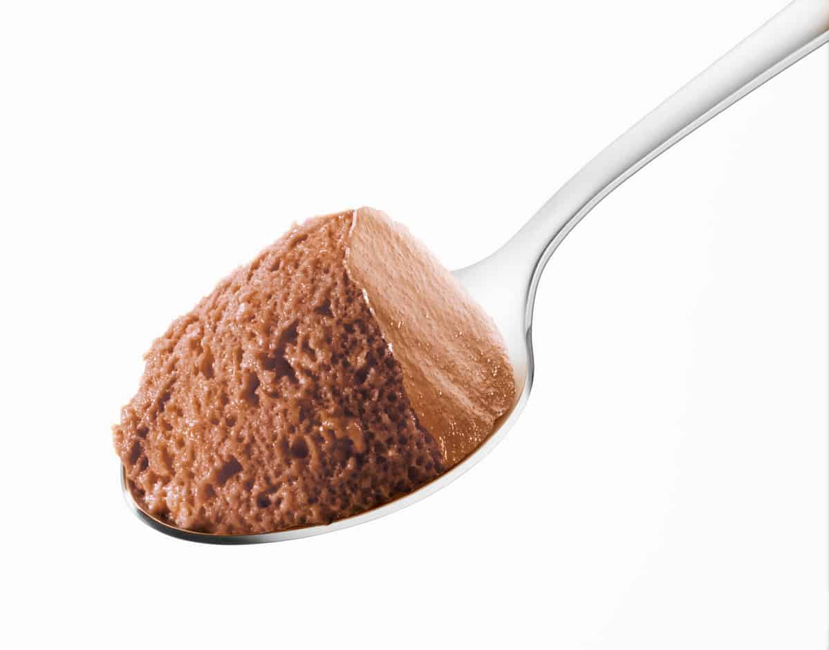 Chocolate mousse spoon on a white background