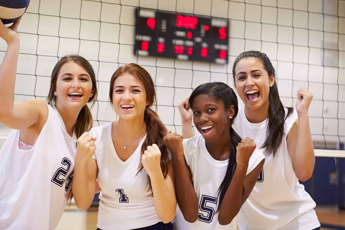 High school students enjoying a game of volleyball.