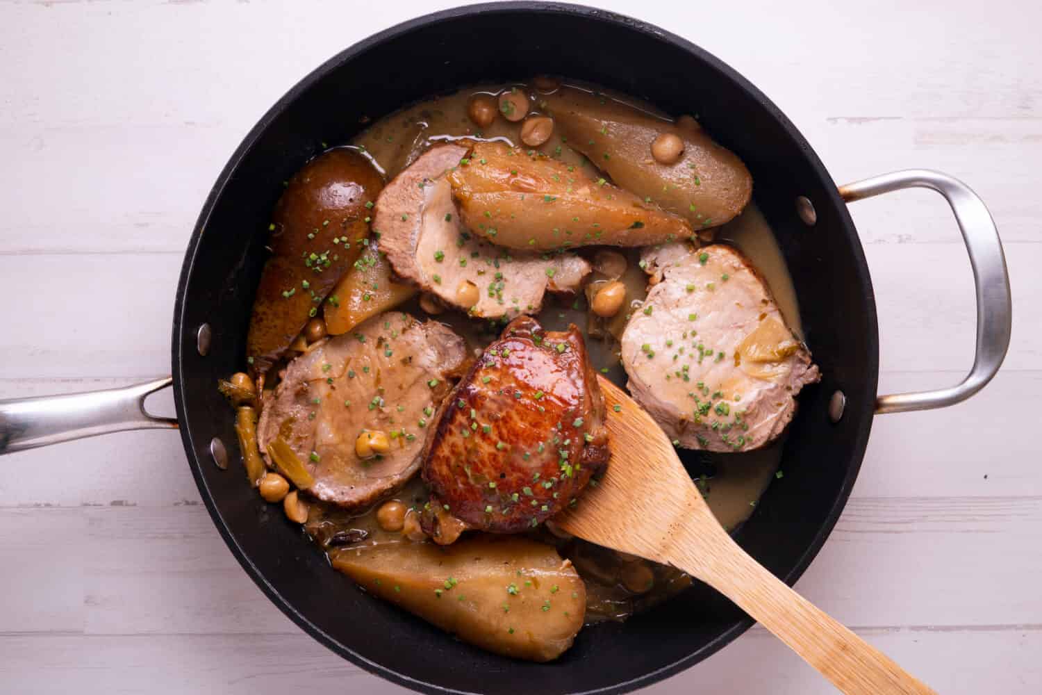 Pork loin cooked with pears and hazelnuts. Traditional Spanish tapa.