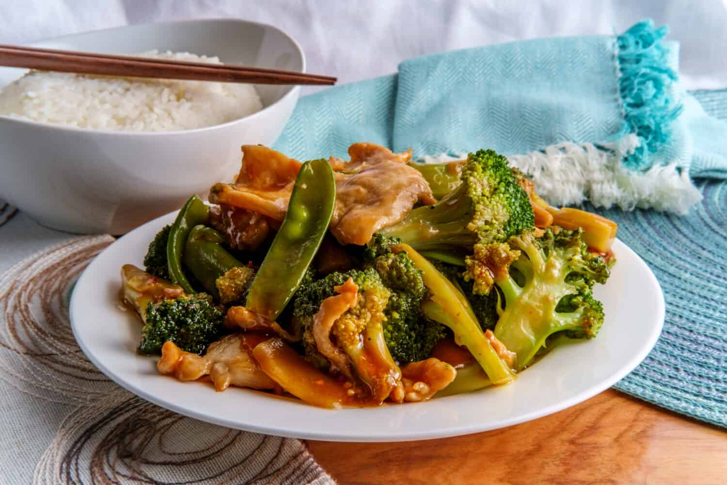 Chinese Hunan style spicy chicken with mixed sauteed vegetables and white rice