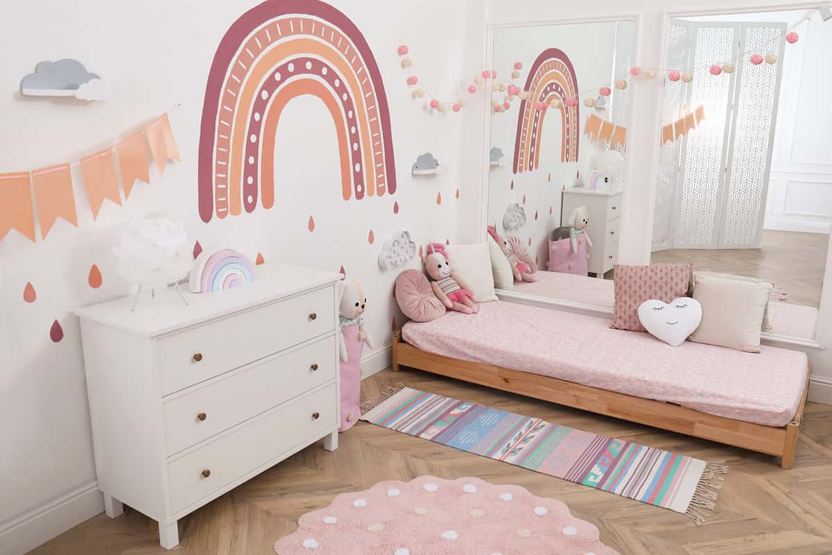 Montessori bedroom interior with floor bed and toys