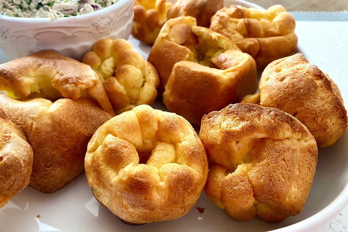 Popovers Fresh popover muffins are served on a white platter. Yorkshire pudding