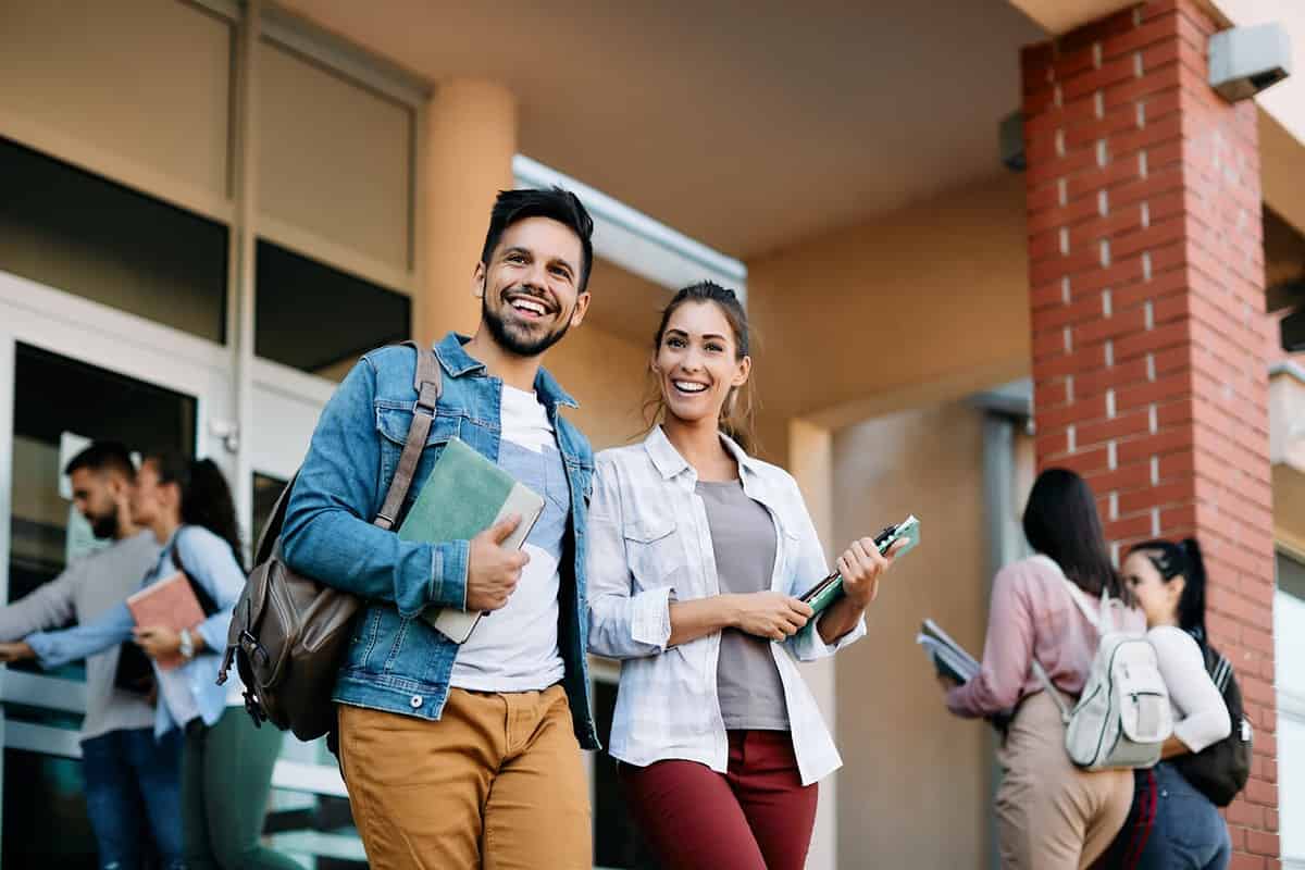 Two university students walking together on the Texas Christian University campus.