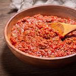 bowl of meat sauce bolognese on a wooden table