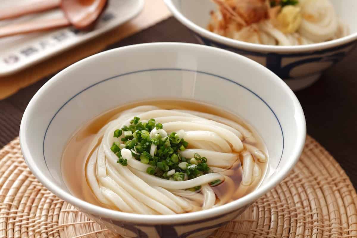 Udon noodle soup, Japanese food on woven rattan jute Placemat.