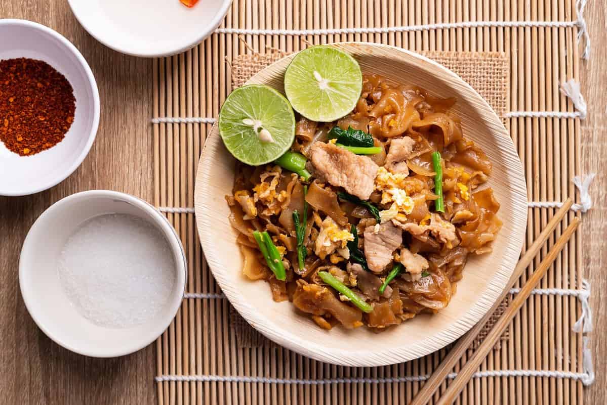 Thai food (Pad See Ew), Stir fried rice noodles with soy sauce, egg, kale and pork, Table top view