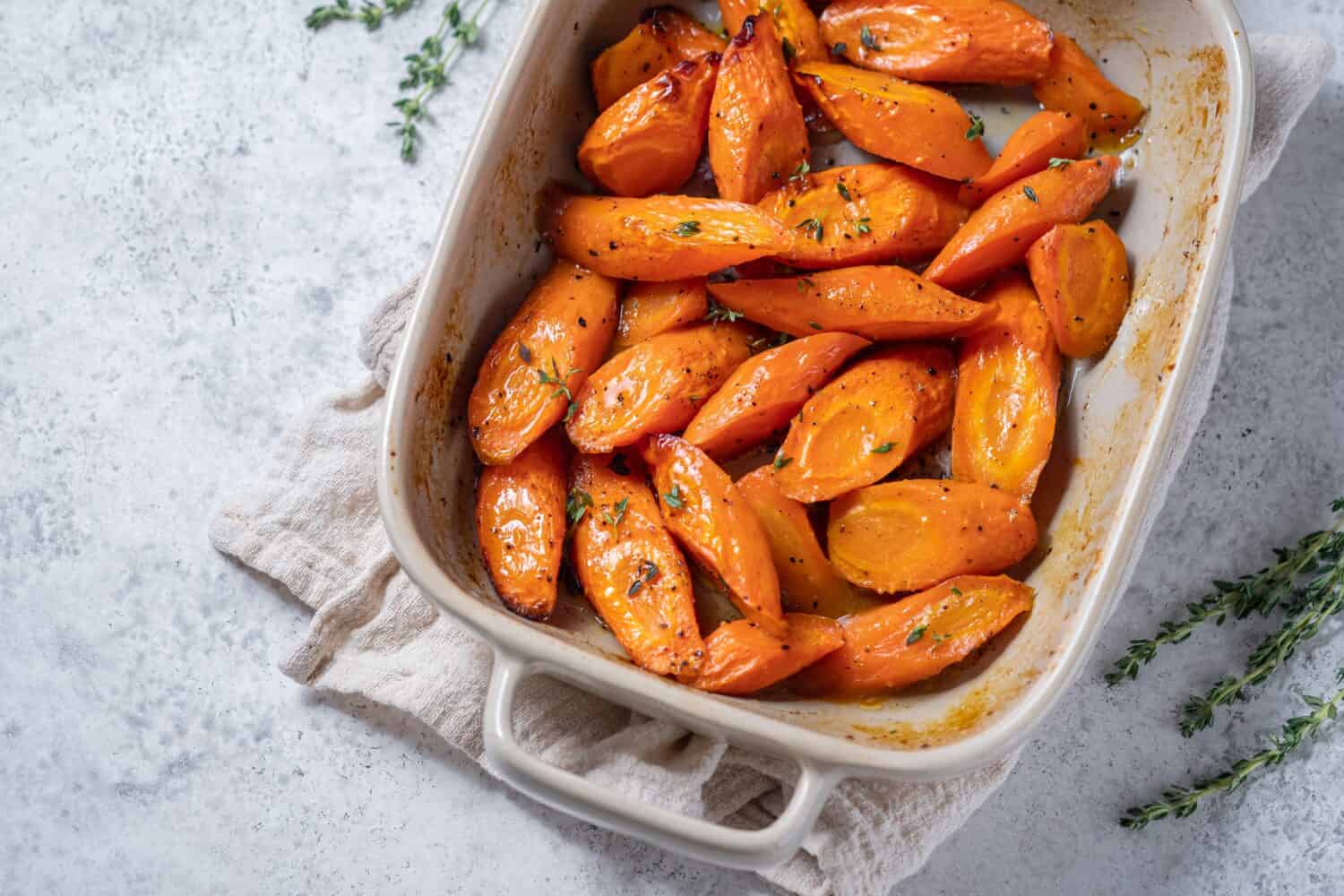 Honey coasted and glazed roasted carrots. Tasty and delicious vegetable side dish.