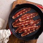 Turkey bacon cooked on a cast iron pan ready to eat