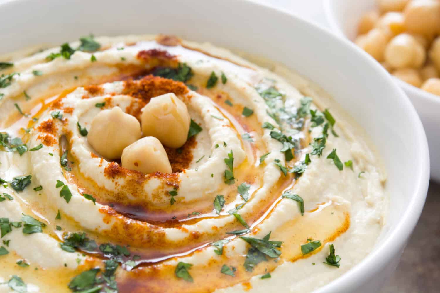 Hummus on a rustic wooden table