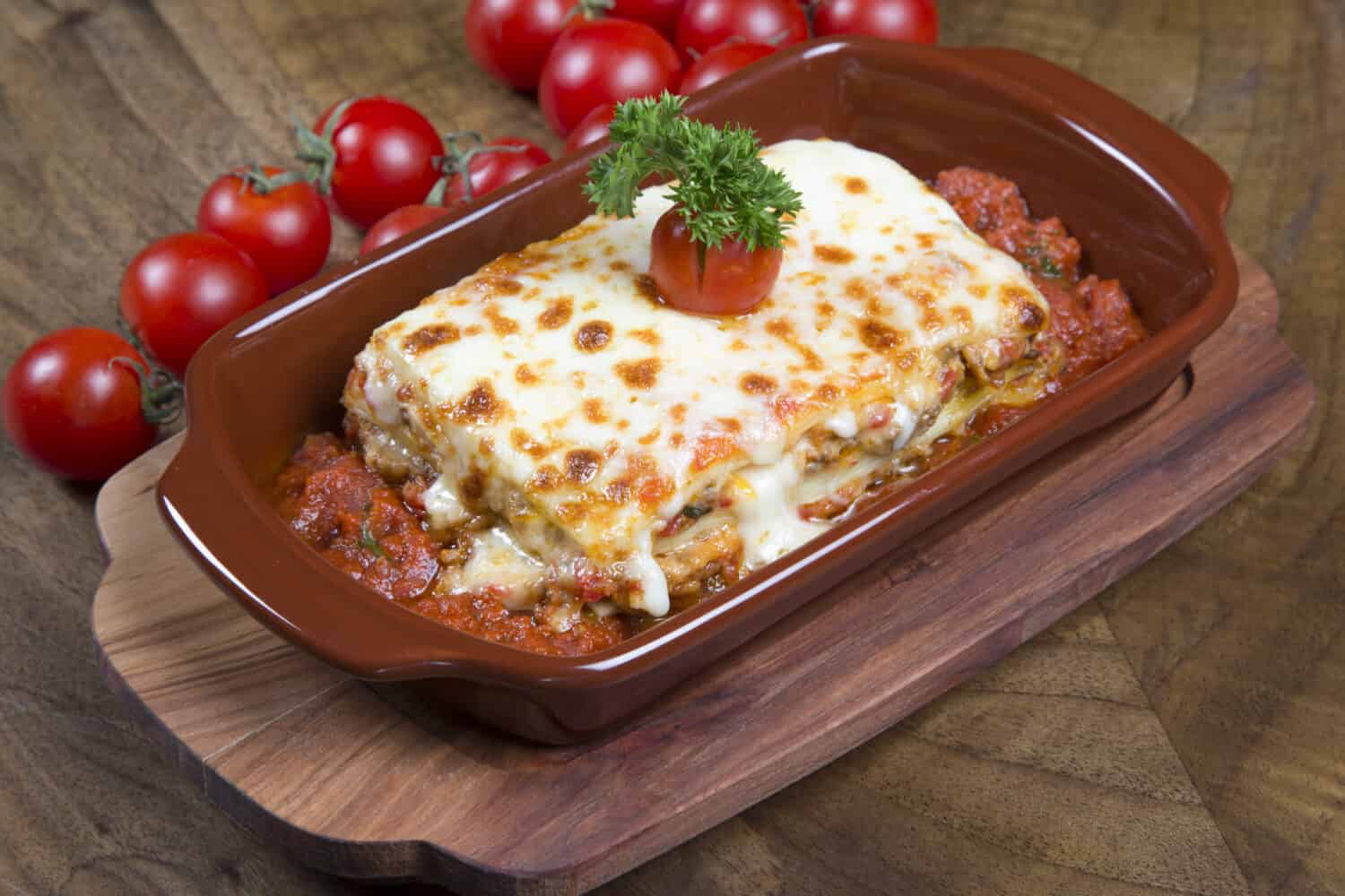 delicious lasagna plate on wooden table