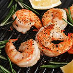 Grilled tiger shrimps with spice and lemon. Grilled seafood.