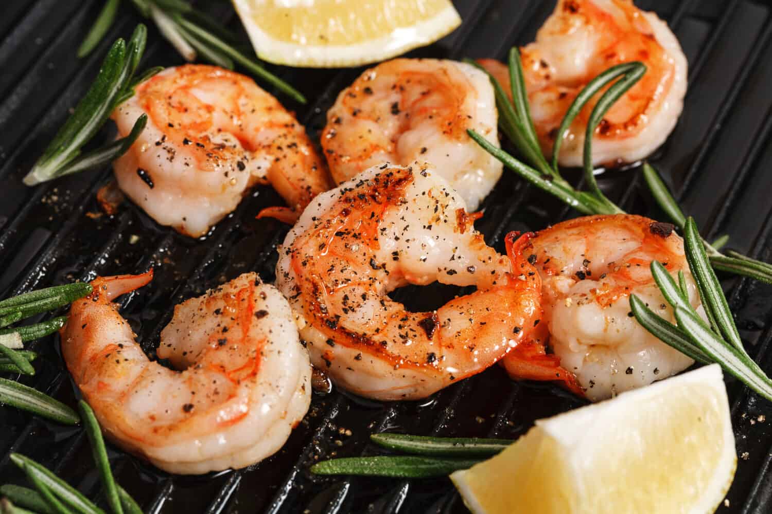 Grilled tiger shrimps with spice and lemon. Grilled seafood.