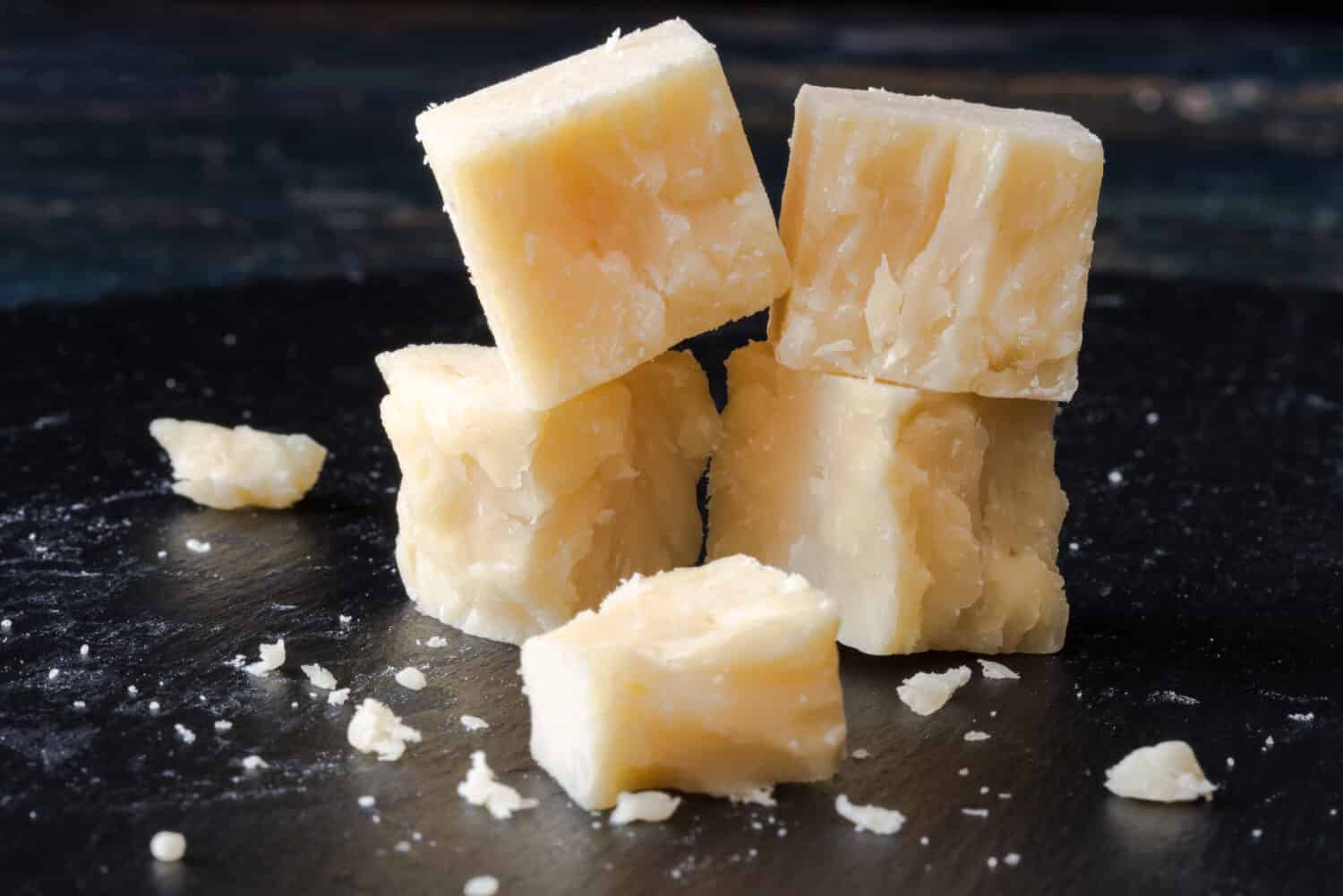 White Cheddar Cheese Cubes on a Black Slate