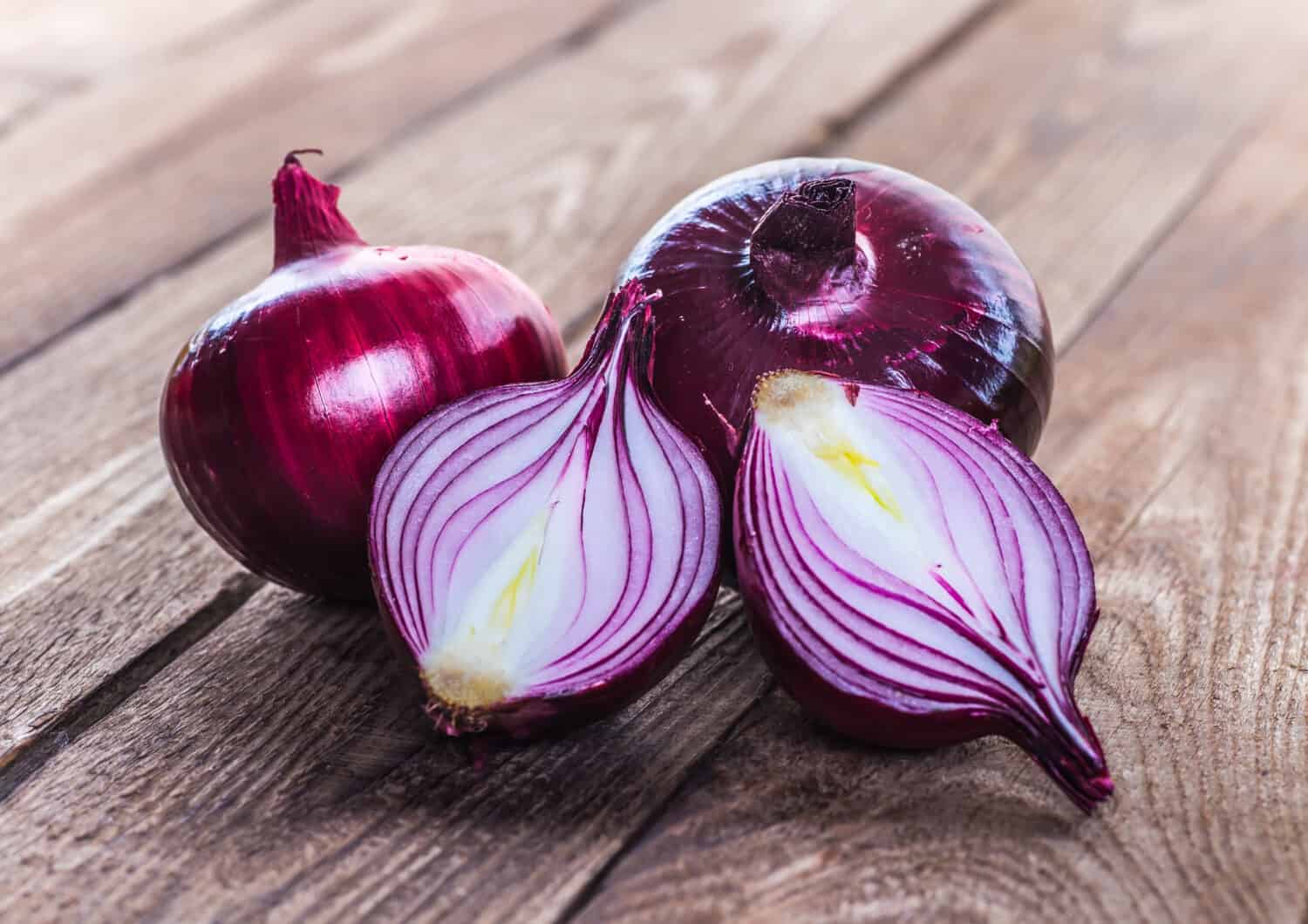 red onions on rustic wood